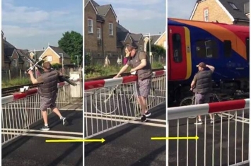 英国伦敦男子非法闯栏杆 险遭高速列车撞倒